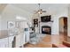 Bright and cozy living room featuring a fireplace, a plush sofa, and an area rug at 2197 Duke Of York St, Carmel, IN 46032