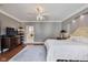 Spacious main bedroom features a ceiling fan, recessed lighting, and an ensuite bathroom at 2197 Duke Of York St, Carmel, IN 46032