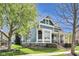 View of home's side showing windows, siding, landscaping, and porch with steps at 2197 Duke Of York St, Carmel, IN 46032