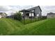 Well-manicured backyard featuring lush lawn, secure fencing, and inviting outdoor amenities for luxurious living at 2280 Meadow Crk, Avon, IN 46123