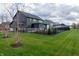 Expansive backyard featuring a lush lawn, secure fencing, and stylish architecture, ideal for outdoor enjoyment at 2280 Meadow Crk, Avon, IN 46123