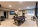 Basement game room with a pool table, TV, arcade games, and comfortable seating area at 2280 Meadow Crk, Avon, IN 46123