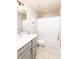 Bathroom with a quartz countertop vanity, toilet and shower tub with tile flooring at 2280 Meadow Crk, Avon, IN 46123