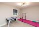 Bedroom featuring an air hockey table and gymnastics equipment, illuminated by a modern chandelier at 2280 Meadow Crk, Avon, IN 46123