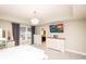 Well-lit Primary bedroom boasting a chandelier, large window, and access to the Primary bathroom at 2280 Meadow Crk, Avon, IN 46123