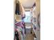Walk-in closet featuring built-in shelving, hanging racks, and a window for natural light at 2280 Meadow Crk, Avon, IN 46123