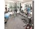 Home gym featuring rubber flooring, weight machines, free weights, and mirrored walls at 2280 Meadow Crk, Avon, IN 46123