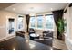 Cozy living room with a modern light fixture, black-out curtains, and comfortable seating arrangement at 2280 Meadow Crk, Avon, IN 46123