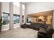 Bright living room with a vaulted ceiling, hardwood floors, and views of the kitchen and backyard at 2280 Meadow Crk, Avon, IN 46123