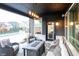 Relaxing covered patio with comfortable seating, stylish rug, and a modern fire pit table for outdoor enjoyment at 2280 Meadow Crk, Avon, IN 46123
