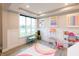Well-lit playroom with wainscotting and a large window at 2280 Meadow Crk, Avon, IN 46123