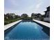 Stunning backyard pool showcasing a seamless design with relaxing lounge area and lush landscaping at 2280 Meadow Crk, Avon, IN 46123