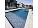 Modern backyard pool with blue tile and sleek design, perfect for luxurious outdoor living at 2280 Meadow Crk, Avon, IN 46123