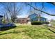 Backyard featuring lush grass, a trampoline, patio area and mature trees at 2372 S 300 E, Anderson, IN 46017