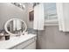 Bathroom featuring grey walls, single sink vanity, tile backsplash and modern fixtures at 2372 S 300 E, Anderson, IN 46017