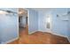 Bedroom features wood floors and blue walls at 2372 S 300 E, Anderson, IN 46017