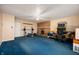 Spacious bonus room features brick fireplace and blue carpet at 2372 S 300 E, Anderson, IN 46017
