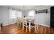 Elegant dining room with a chandelier, hardwood floors, and large windows offering great natural light at 2372 S 300 E, Anderson, IN 46017