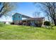 Spacious home with a large yard, showcasing the exterior with its well-kept lawn and ample space at 2372 S 300 E, Anderson, IN 46017