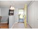 Bright entryway featuring a modern light fixture and neutral color palette, welcoming guests into the home at 2372 S 300 E, Anderson, IN 46017