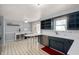 Kitchen features tiled floors and stainless steel dishwasher at 2372 S 300 E, Anderson, IN 46017