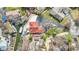 Stunning aerial view of waterfront home with private dock, lush landscaping, and charming red tile roof at 2469 Cape Henry Ct, Cicero, IN 46034