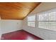 An attic with high windows, updated flooring and walls with a wood ceiling at 2469 Cape Henry Ct, Cicero, IN 46034