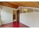 Spacious attic with view of ceiling fan, door, and high windows at 2469 Cape Henry Ct, Cicero, IN 46034