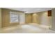 An unfinished basement includes an exterior access door and neutral paint at 2469 Cape Henry Ct, Cicero, IN 46034