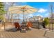 Deck offers stunning lake views, seating area, and a large umbrella for shade at 2469 Cape Henry Ct, Cicero, IN 46034