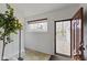 Bright entryway with wood-look tile flooring, a front door, and a view of the outside at 2469 Cape Henry Ct, Cicero, IN 46034