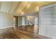 Bright open living area with beautiful vaulted ceilings, wood floors, and built in bookshelves at 2469 Cape Henry Ct, Cicero, IN 46034