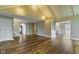 Open-concept living room boasts wood floors, and vaulted ceilings, creating a spacious atmosphere at 2469 Cape Henry Ct, Cicero, IN 46034