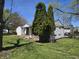 View of home with lush landscaping surrounding exterior, highlighting the serene setting at 2950 Denison St, Indianapolis, IN 46241