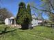 Side view of a single-story house with green trees in the background at 2950 Denison St, Indianapolis, IN 46241