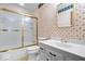 Retro-style bathroom with floral wallpaper, a white vanity, and a shower with gold trim at 315 Heritage Ct, Fishers, IN 46038