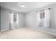 Bright bedroom with two windows and neutral carpeting provides a blank canvas for customization at 315 Heritage Ct, Fishers, IN 46038