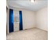 A cozy bedroom featuring a plush carpet, cream walls, and window with blue drapes at 315 Heritage Ct, Fishers, IN 46038