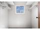 Spacious closet featuring a window for natural light and ample storage on metal rails at 315 Heritage Ct, Fishers, IN 46038