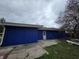 Home with blue siding and a concrete patio, perfect for outdoor relaxation and entertaining at 3162 Wallace Ave, Indianapolis, IN 46218