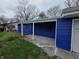 This home offers a covered carport and blue siding at 3162 Wallace Ave, Indianapolis, IN 46218