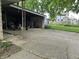 Spacious detached garage with ample storage and a long, paved driveway at 3250 Hillcrest Dr, Columbus, IN 47203