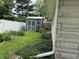 Backyard shows shed and flower garden in yard at 3315 Hillcrest Dr, Columbus, IN 47203