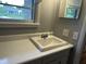 Bathroom sink with white counter and natural light at 3315 Hillcrest Dr, Columbus, IN 47203