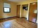 Cozy bedroom featuring hardwood floors, built-in closet, and ample natural light at 3315 Hillcrest Dr, Columbus, IN 47203