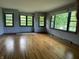 Spacious living room boasts beautiful hardwood floors and many windows to provide lots of natural light at 3315 Hillcrest Dr, Columbus, IN 47203