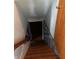 Stairwell leading to the basement with carpeted steps and decorative railings at 3315 Hillcrest Dr, Columbus, IN 47203
