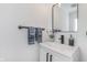 Bathroom featuring a modern vanity, dark fixtures, and decor at 333 S Fourth St, Zionsville, IN 46077