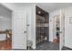 Bathroom featuring a slate tile walk-in shower with glass door and tiled floors at 333 S Fourth St, Zionsville, IN 46077