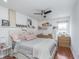 Comfortable bedroom featuring a ceiling fan, wood floors and decor shelving at 333 S Fourth St, Zionsville, IN 46077